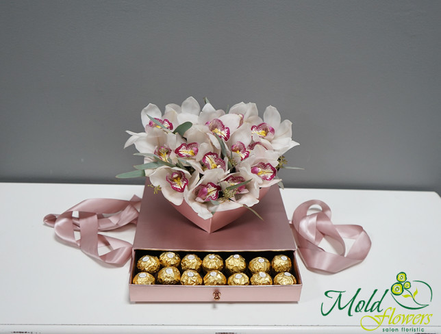 Heart-shaped box with white orchids photo